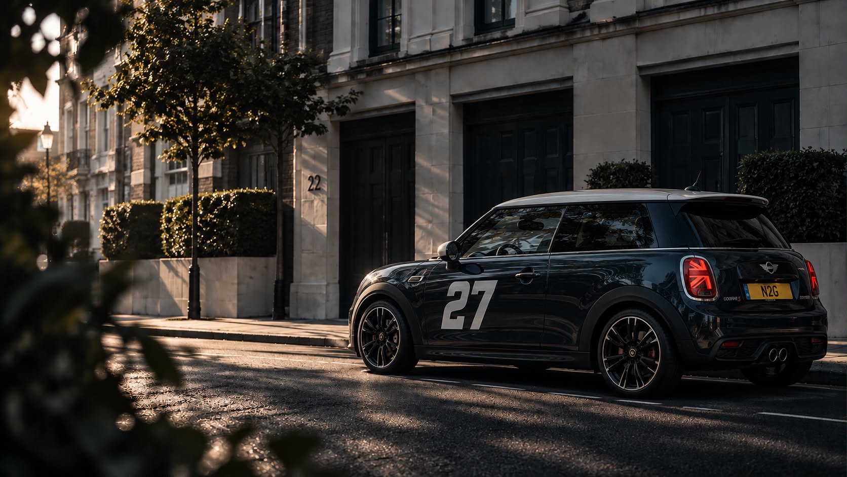 Black MINI Cooper on a sunlit London street